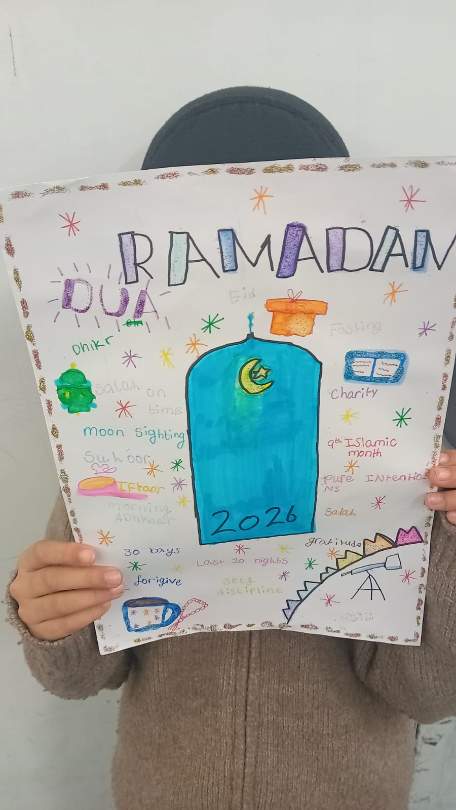 A pupil presenting their detailed Ramadan project